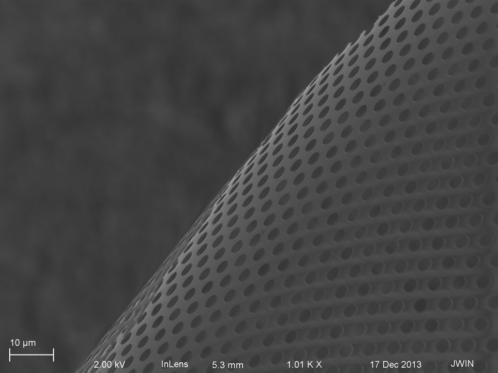 Curled Cytovu membrane post 200nm MgF2 deposition. The 'scumming' in the lower left corner is probably the MgF2