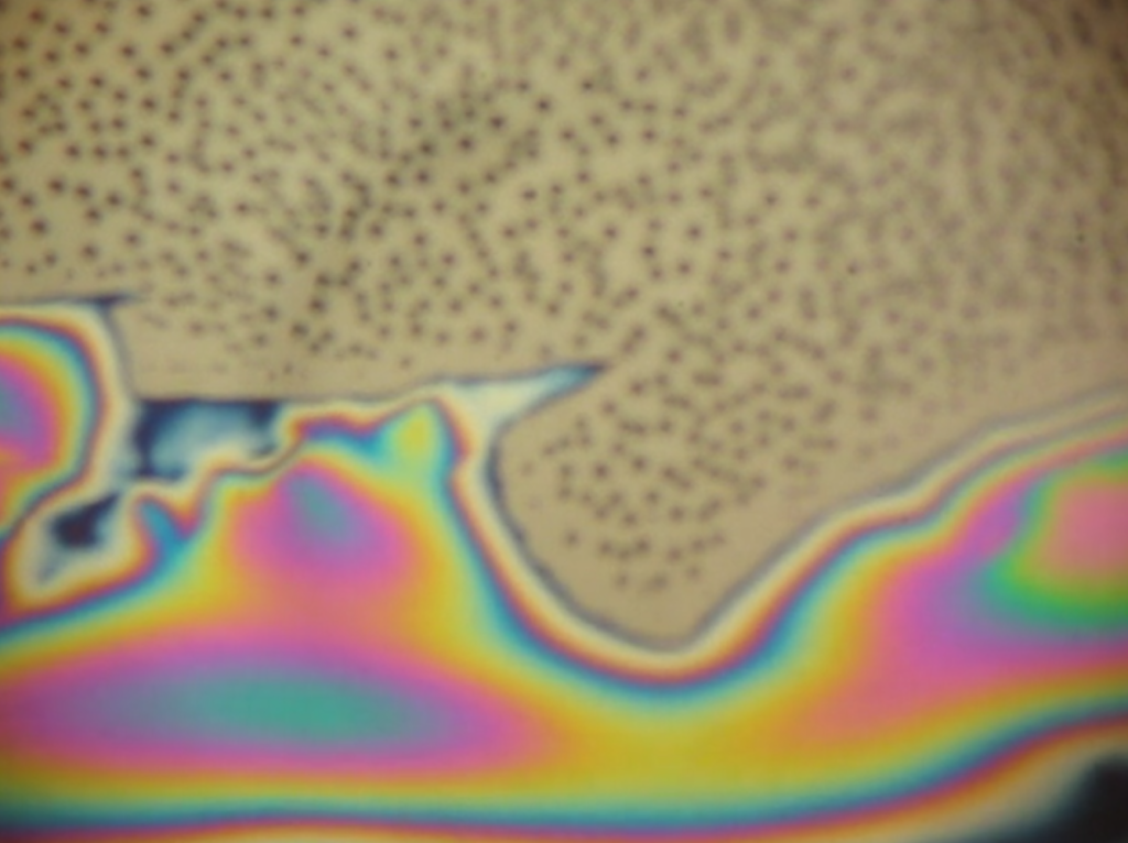 Water sheets over NPN, but forms droplets only on silicon nitride.