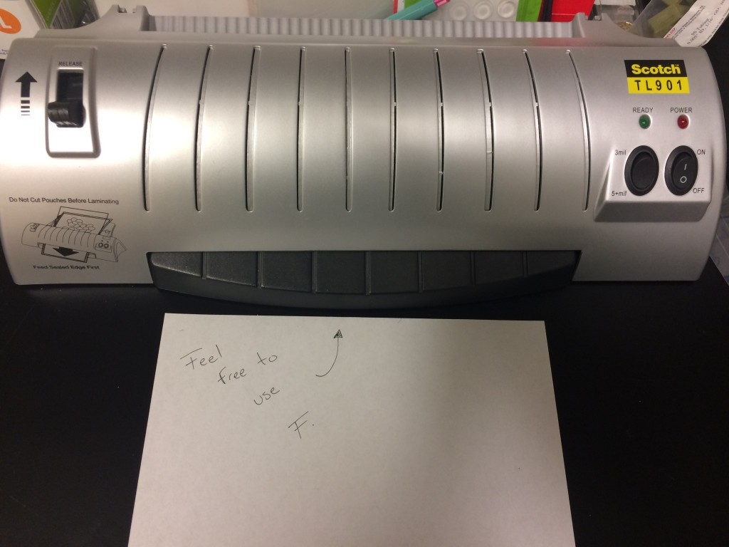 The Laminator takes pouches, and rolls them through a heating element, fusing the glue on the inner surface of the pouch.