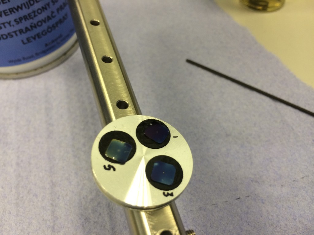 Samples affixed to bar for cleaning. 