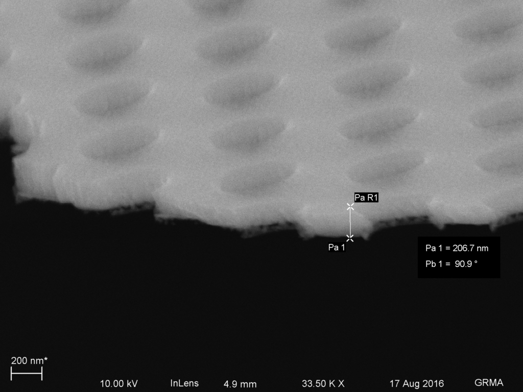 Fully etched MgF2. Some infilling is apparent as the pyramidal rim structures exist below the bottom plane of the holes.
