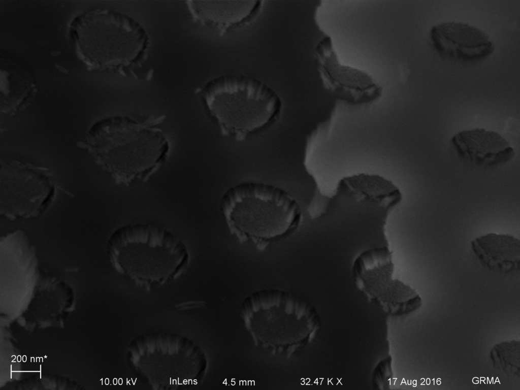 Unetched MgF2 (right) on microporous silicon nitride (left) in the bulk region. The direct line of sight deposition makes tiny nano mesas in the micropores.