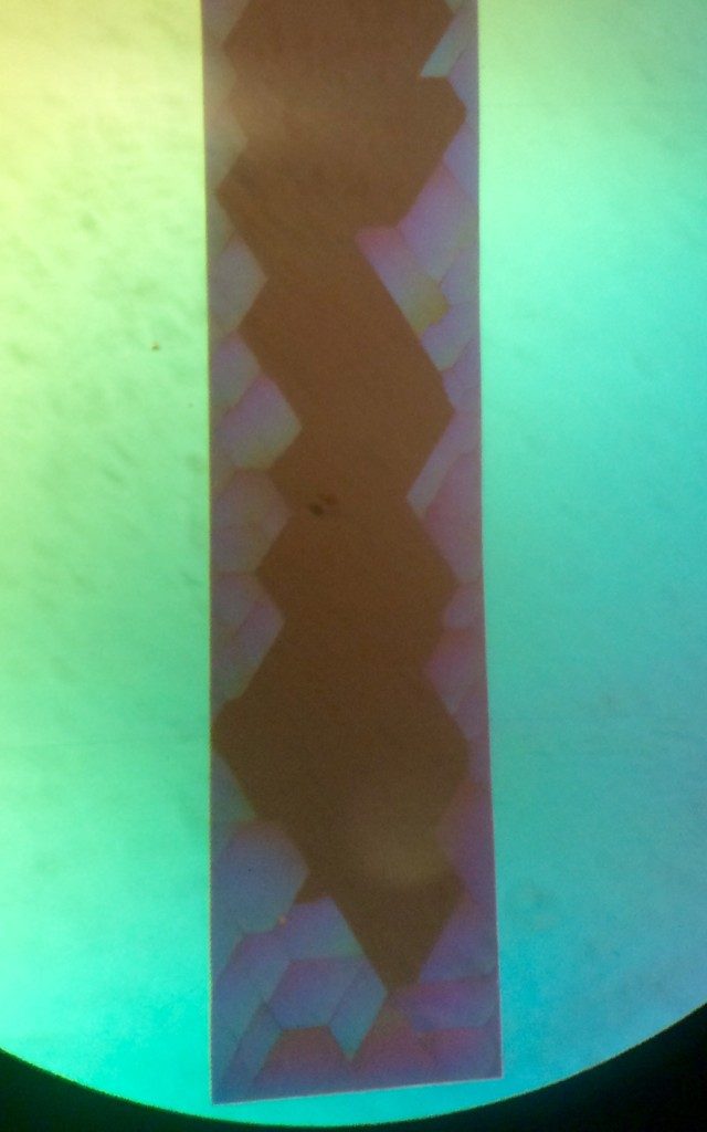 Broken microporous MgF2. Whereas the thinner MgF2 (50 nm) has made curls previously, these thicker microporous MgF2 have shattered in very sharp angles.